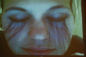 Eyelashes | Over elaborate eyelashes made from my own hair, me, Skype video projection | 3hrs | 2009. 
